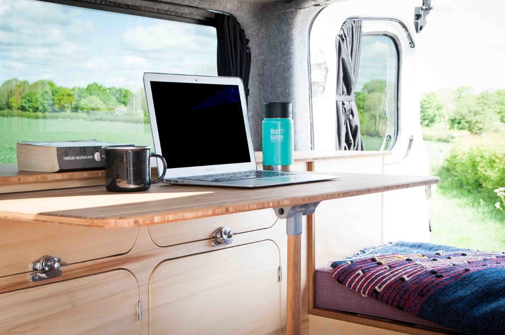 A laptop in a Sunbox Campers campervan